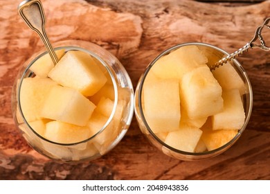 Melon. Pieces Of Fresh Melon For Making Fruit Dessert In Glass On An Old Wooden Background. Mock Up. Top View.