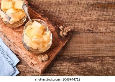 Melon. Pieces Of Fresh Melon For Making Fruit Dessert In Glass On An Old Wooden Background. Mock Up. Top View.