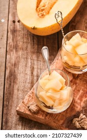 Melon. Pieces Of Fresh Melon For Making Fruit Dessert In Glass On An Old Wooden Background. Mock Up. Top View.