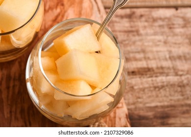 Melon. Pieces Of Fresh Melon For Making Fruit Dessert In Glass On An Old Wooden Background. Mock Up. Top View.