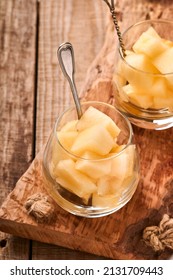 Melon. Pieces Of Fresh Melon For Making Fruit Dessert In Glass On An Old Wooden Background. Mock Up. Top View.