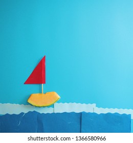 Melon slice sailing in the ocean making from paper.