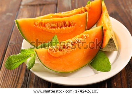 Similar – Image, Stock Photo Melon slices on plate