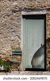 Meloncholy old authentic door in stone wall
