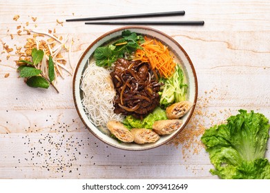 Melted beef and soy sauce, with crispy spring rolls and rice - Shutterstock ID 2093412649