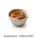 Melted caramel in bowl isolated on  white background. Caramel sauce in bowl. closeup. 