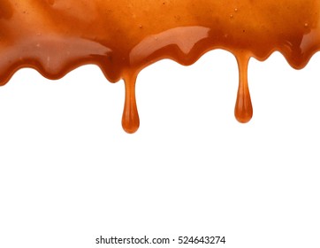 Melted Caramel Dripping Isolated On White Background