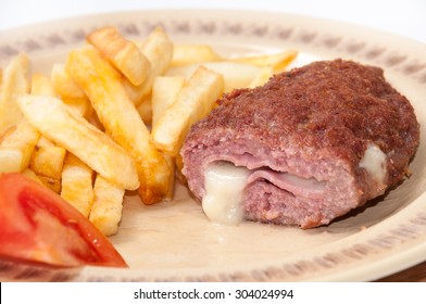 The Melted Cheese Oozes Out Of Stuffed Burgers On A Plate.