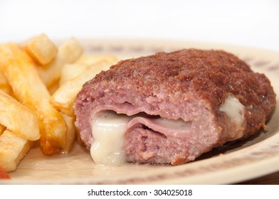 The Melted Cheese Oozes Out Of Stuffed Burgers On A Plate.