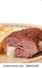 The Melted Cheese Oozes Out Of Stuffed Burgers On A Plate.