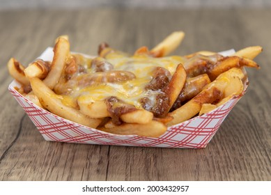 Melted Cheese Smothers This Entire Boat Of Chile Cheese French Fries As A Very Filling Side Dish.