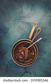 Melted Chocolate In A Copper Pan. Top View, Blank Space