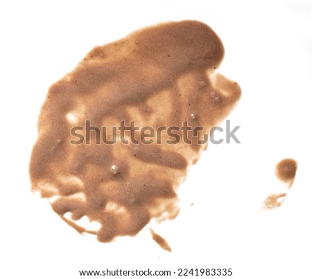melted chocolate ice cream stain isolated on white background, top view