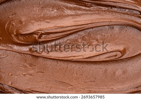 Melted chocolate texture background. Close-up creme chocolate.