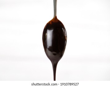 Melted Dark Chocolate On A Spoon