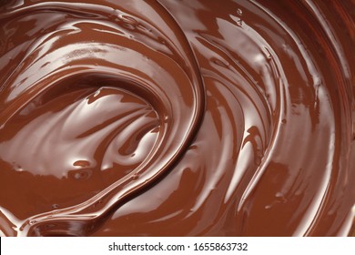 Melted dark chocolate swirl background
