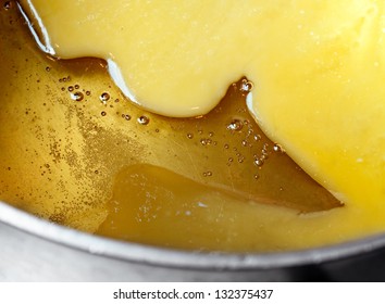 Melted Honey And Butter In Metal Pan