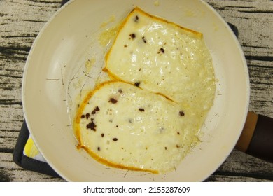 Melted Raclette Cheese On A Pan