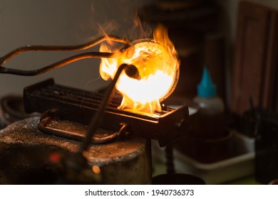 melting with blow torch and foundry of liquid silver from a bowl into a mold - Powered by Shutterstock