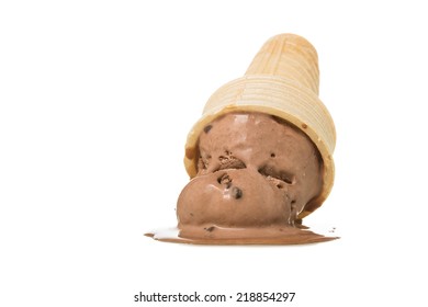Melting chocolate ice cream in cone upside down on white background.