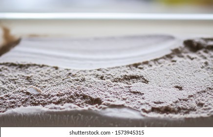 Melting chocolate ice cream surface close up