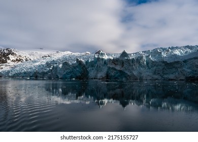 Melting Glacier In Svalbard, Norway. Blue Glacier Ice.