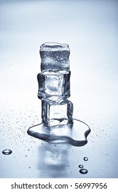 Melting Ice Cubes On A Metal Tabletop