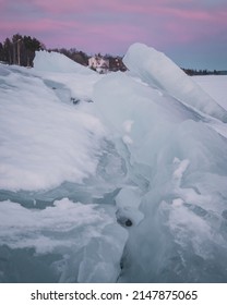 The Melting Ice Floes Stack On The Coast Of Lake Storsjö. Signs Of Global Warming? Sweden Jämtland (Lapland). 