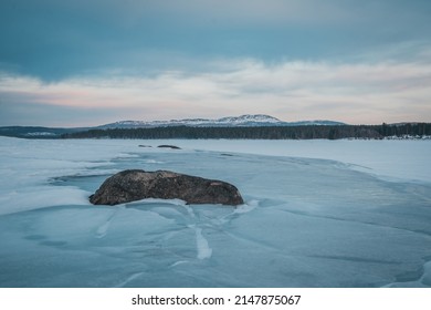 The Melting Ice Floes Stack On The Coast Of Lake Storsjö. Signs Of Global Warming? Sweden Jämtland (Lapland). 