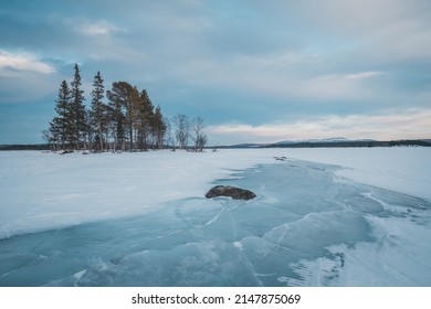 The Melting Ice Floes Stack On The Coast Of Lake Storsjö. Signs Of Global Warming? Sweden Jämtland (Lapland). 