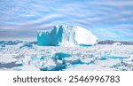 Melting of a iceberg and pouring water into the sea - Greenland - Tiniteqilaaq, Sermilik Fjord, East Greenland