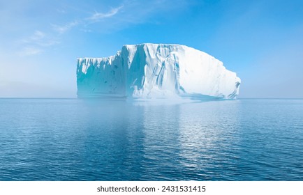 Melting icebergs by the coast of Greenland, on a beautiful summer day - Melting of a iceberg and pouring water into the sea - Greenland - Powered by Shutterstock