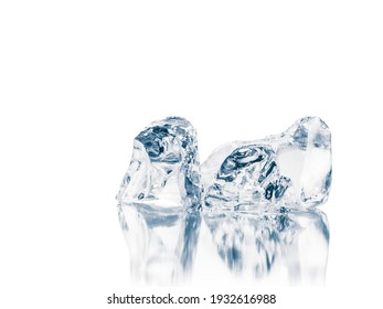 Melting natural crystal clear ice cubes on reflective surface. Isolated on white.