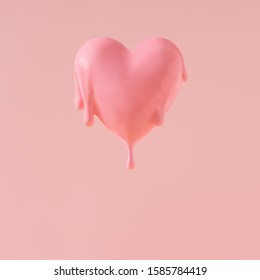 Coeur rose fondu sur fond pastel. L'amour créatif ou les valentines minimes concept.