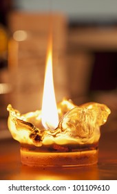 Melting Plastic Lit Candle With Big Flame