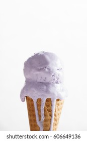 Melting Purple Color Ice Cream On Waffle Cone