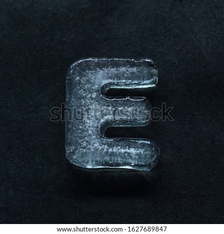 Melting speech. Alphabet's shiny and well-structured letters made out of ice isolated on dark studio background. Collect for combine in words. Copyspace to insert your advertising.