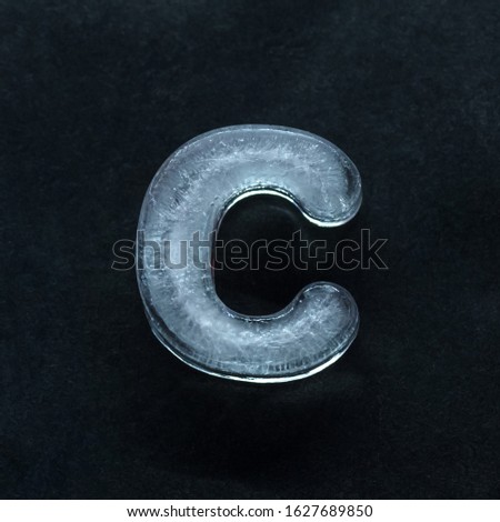 Melting speech. Alphabet's shiny and well-structured letters made out of ice isolated on dark studio background. Collect for combine in words. Copyspace to insert your advertising.