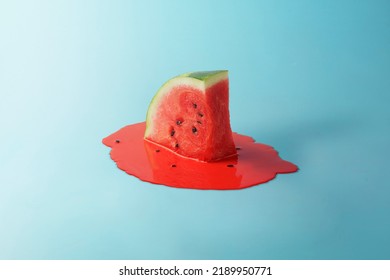 Melting watermelon slice on blue background with space for text. Creative summer composition.  - Shutterstock ID 2189950771