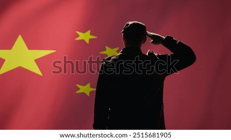 Member of chinese army doing saluting hand gesture towards China flag in command center, showing respect. Military unit in uniform serving Chinese Communist Party, doing honoring gesturing, camera B