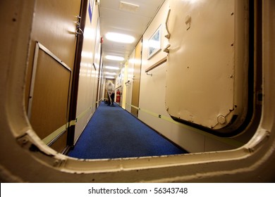 A Member Of The Crew Staff Cleaning The Carpets In The Cabins Area Aboard A Cruise Ship