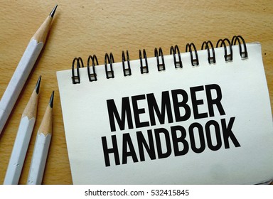 Member Handbook Text Written On A Notebook With Pencils