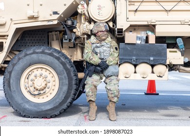 A Member Of The National Guard Sits On A Truck On A Blocked Off Street On January 19, 2021 In Washington D.C. 