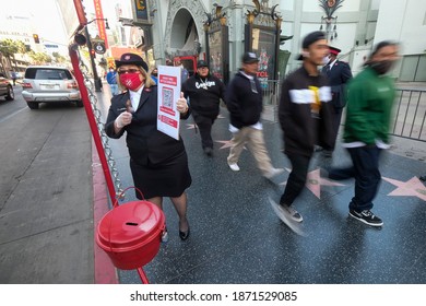 A Member Of Salvation Army Asks For Donation During Their Signature Red Kettle Donation Collection In A Drive-thru Format Due To The Coronavirus Pandemic,Dec. 10, 2020 In Los Angeles.