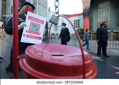 A Member Of Salvation Army Asks For Donation During Their Signature Red Kettle Donation Collection In A Drive-thru Format Due To The Coronavirus Pandemic,Dec. 10, 2020 In Los Angeles.