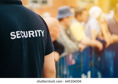 Member Of Security Guard Team Working On Public Event, Unrecognizable Male Person From Behind