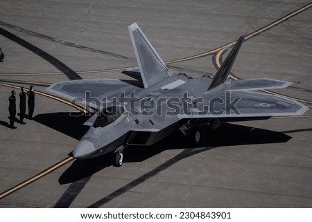 Members of the Air Combat Command F-22 Raptor Demonstration Team prepare to launch out during a performance at Joint Base Elmendorf-Richardson, Alaska