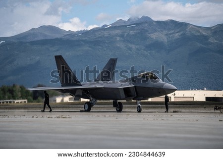 Members of the Air Combat Command F-22 Raptor Demonstration Team prepare to launch a jet during a demonstration at Joint Base Elmendorf-Richardson, Alaska