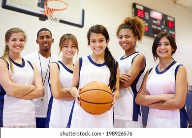 Members Of Female High School Basketball Team With Coach - Powered by Shutterstock