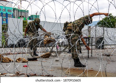 Members Of Malaysian Armed Forces Are Open The Barbed Wire Following Enhanced Movement Control Order In Nilai, Negeri Sembilan, Malaysia On December 1, 2020